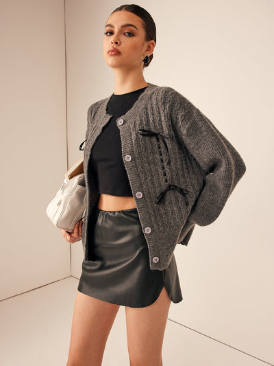 Strickjacke mit Zierschleifen | Strukturmuster | Feminine Details