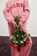 Rosa mit Roten Buchstaben